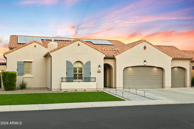 mediterranean / spanish house with a garage