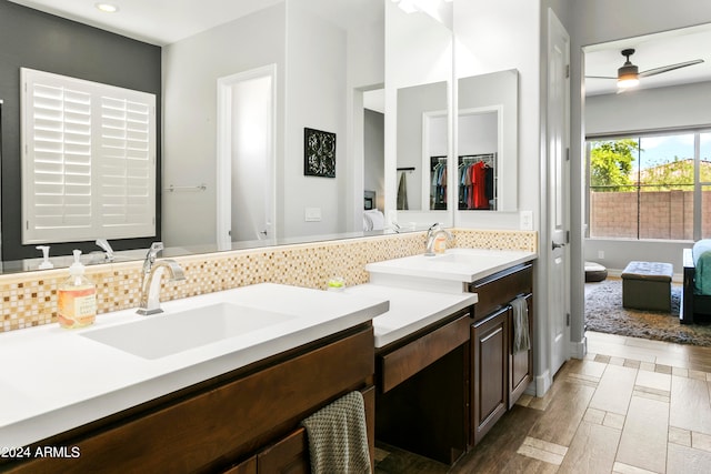 bathroom with ceiling fan, wood-type flooring, and vanity