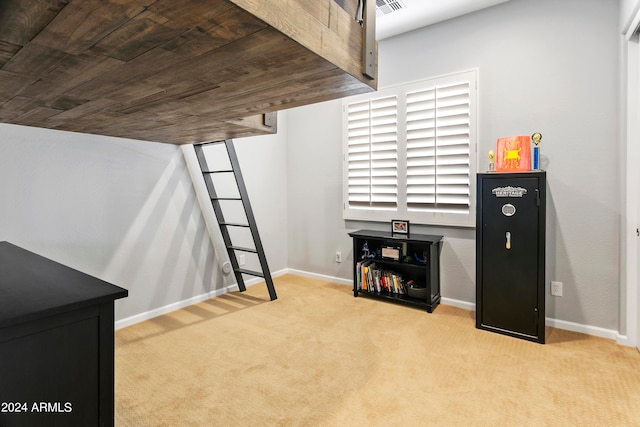 interior space with wooden ceiling and light colored carpet