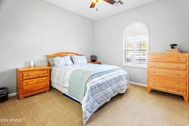 carpeted bedroom with ceiling fan