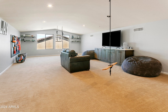 living room featuring vaulted ceiling and light colored carpet