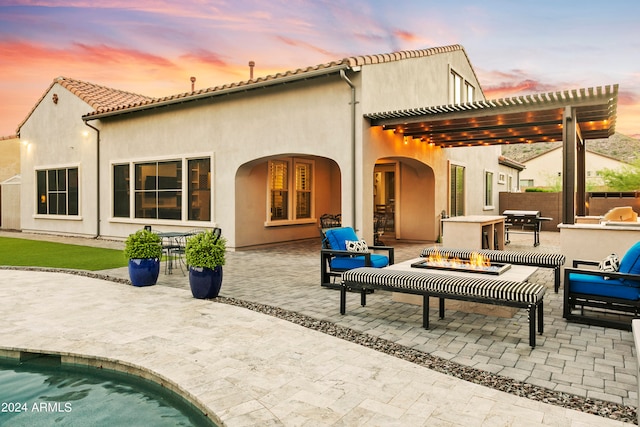 back house at dusk with a patio