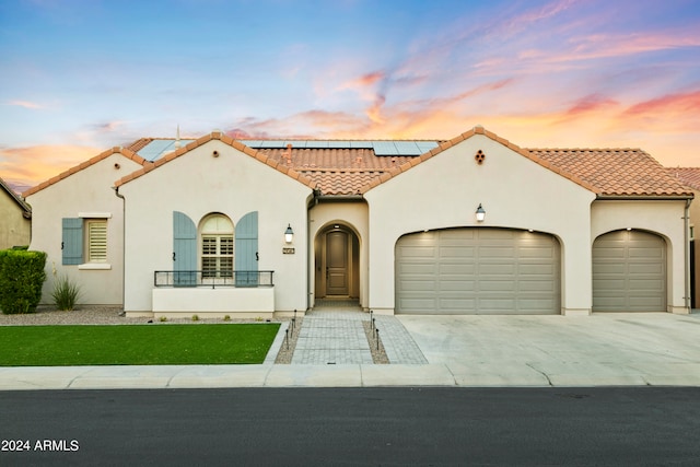 mediterranean / spanish-style house featuring a garage