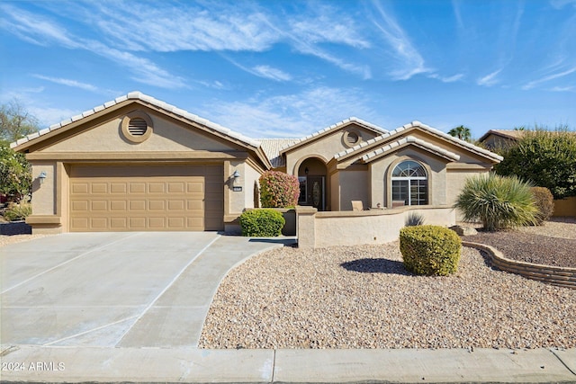 view of front of property featuring a garage