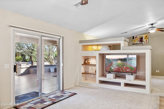 interior space with ceiling fan