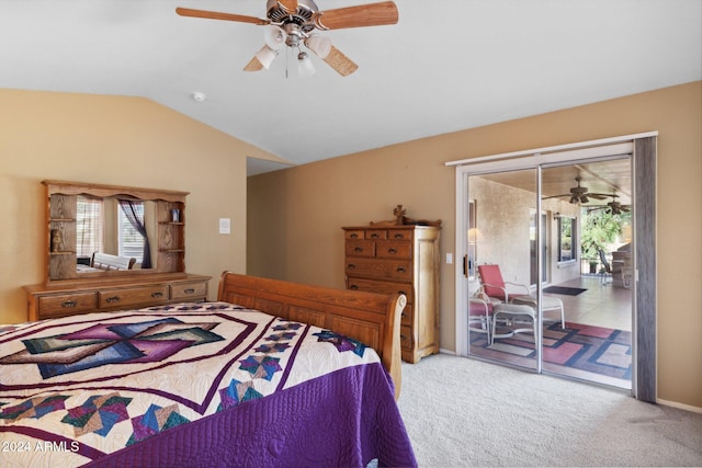 carpeted bedroom featuring access to outside, vaulted ceiling, and ceiling fan