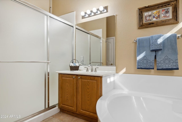 bathroom featuring vanity, tile patterned floors, and separate shower and tub