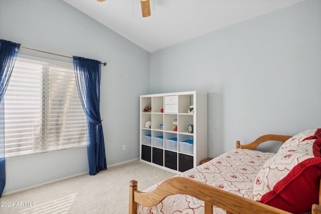 bedroom with carpet flooring, vaulted ceiling, and ceiling fan