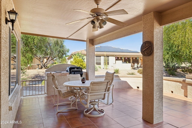 view of patio featuring a mountain view and ceiling fan