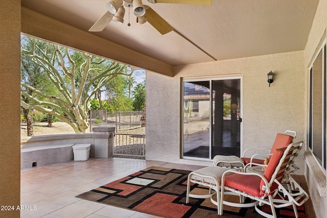 view of patio featuring ceiling fan