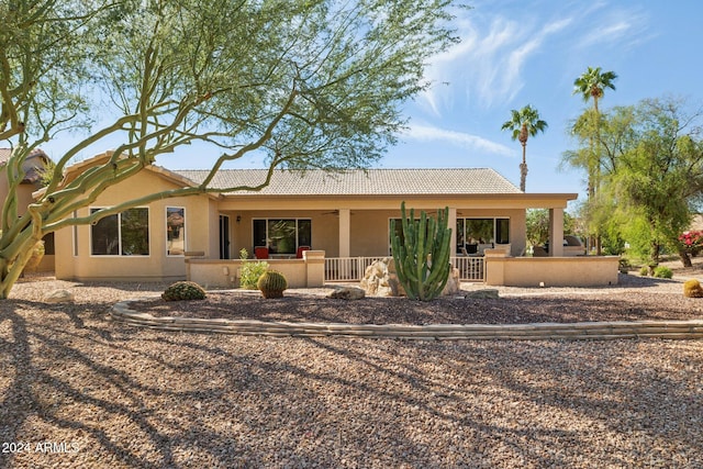 rear view of house with a porch