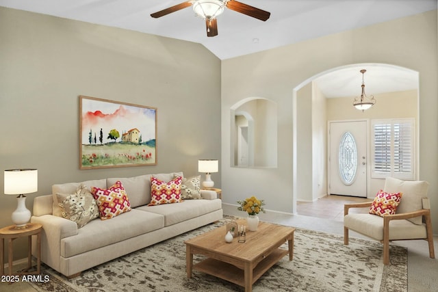 15758 W Edgemont Ave, Goodyear, AZ 85395 - living room featuring arched walkways, a ceiling fan, and vaulted ceiling