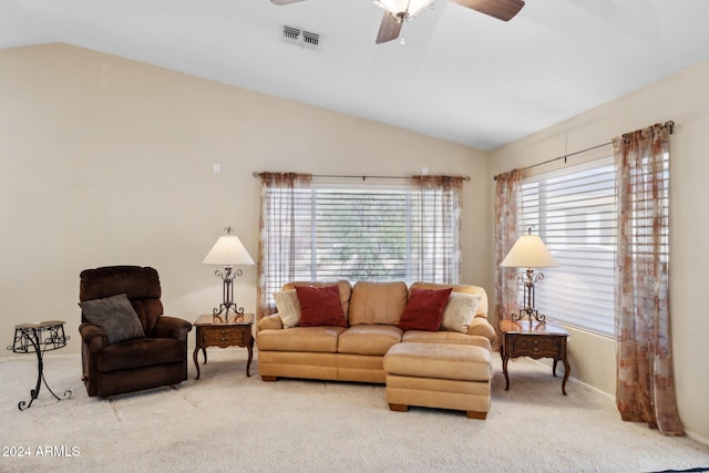 living room with light carpet, lofted ceiling, and ceiling fan