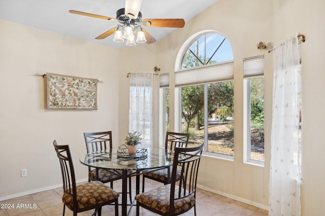 dining room with a healthy amount of sunlight, ceiling fan, and light tile patterned floors