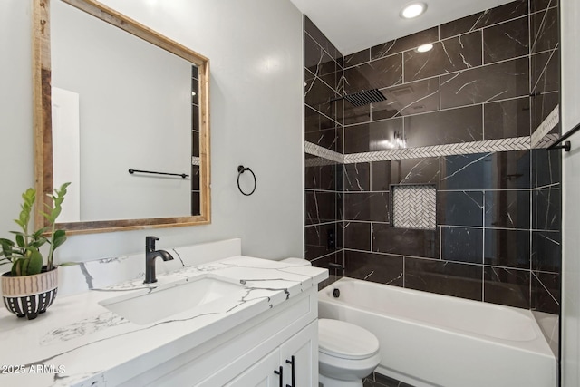 full bathroom featuring  shower combination, vanity, and toilet