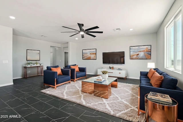 living room featuring baseboards, visible vents, and recessed lighting