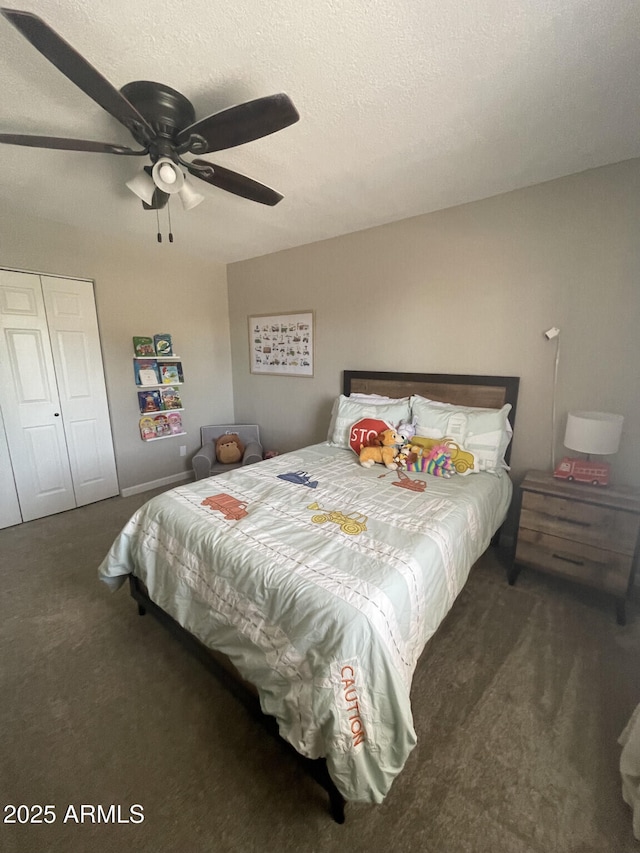 carpeted bedroom featuring a closet, a textured ceiling, and a ceiling fan