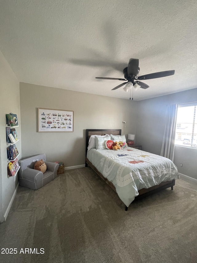 carpeted bedroom with baseboards and ceiling fan