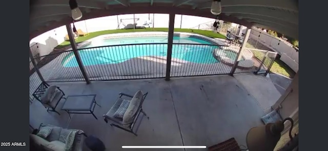 view of pool with a fenced in pool and a patio