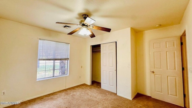 unfurnished bedroom with carpet floors, a closet, ceiling fan, and baseboards