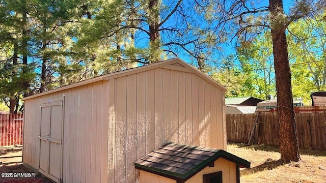 view of shed with a fenced backyard
