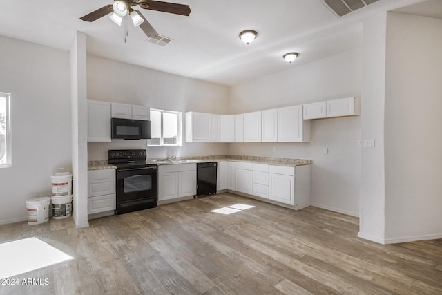 kitchen featuring light hardwood / wood-style floors, white cabinets, black appliances, and ceiling fan