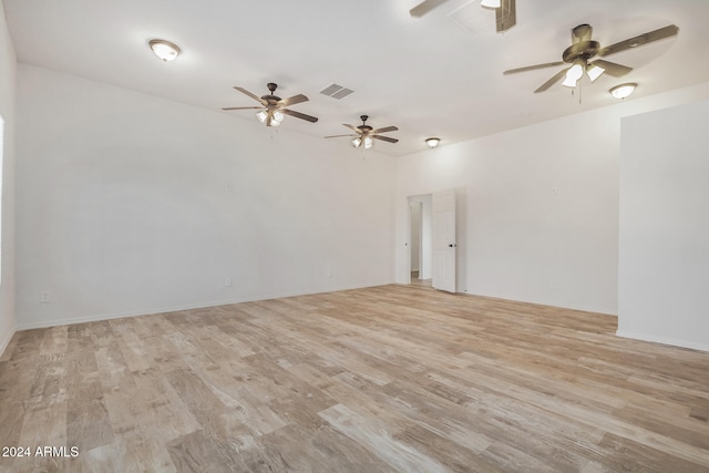 spare room with light hardwood / wood-style flooring and ceiling fan