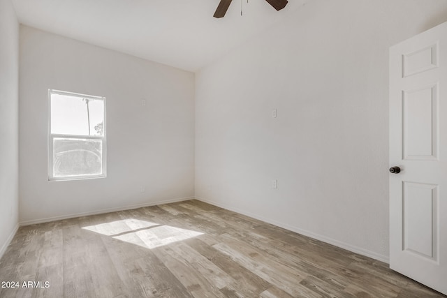 empty room with light hardwood / wood-style flooring and ceiling fan