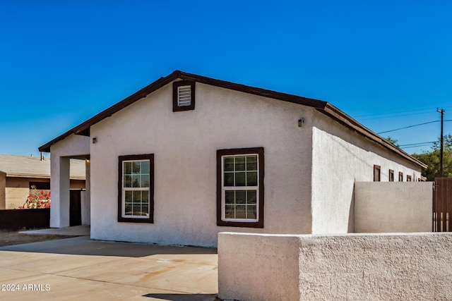 view of home's exterior featuring a patio area