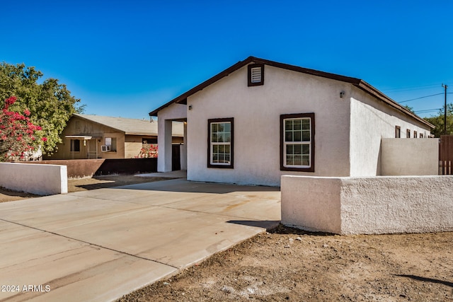 view of front of house with a patio area