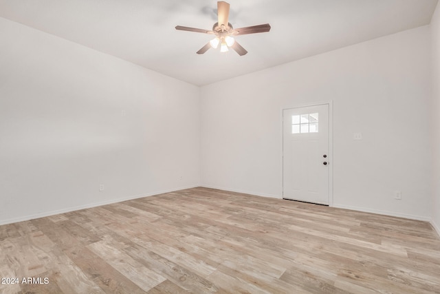 empty room featuring light hardwood / wood-style floors and ceiling fan