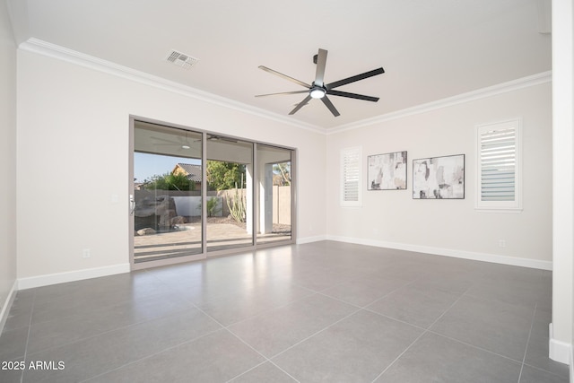 unfurnished room with crown molding, ceiling fan, tile patterned floors, and baseboards