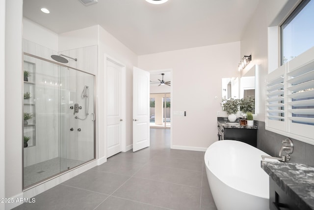full bath featuring a shower stall, vanity, a freestanding tub, and a ceiling fan