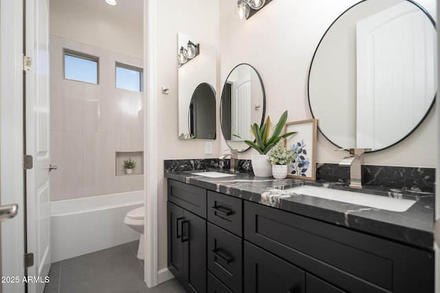 full bathroom featuring double vanity, toilet, tile patterned flooring, and shower / tub combination