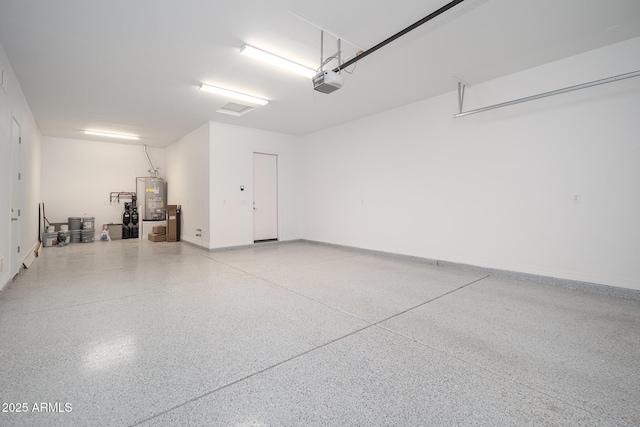 garage with a garage door opener, water heater, and baseboards