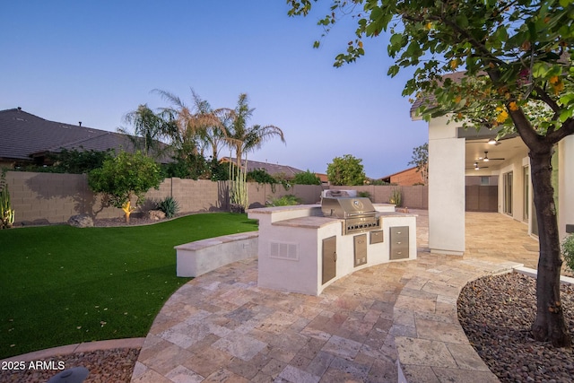 view of patio / terrace featuring grilling area and exterior kitchen