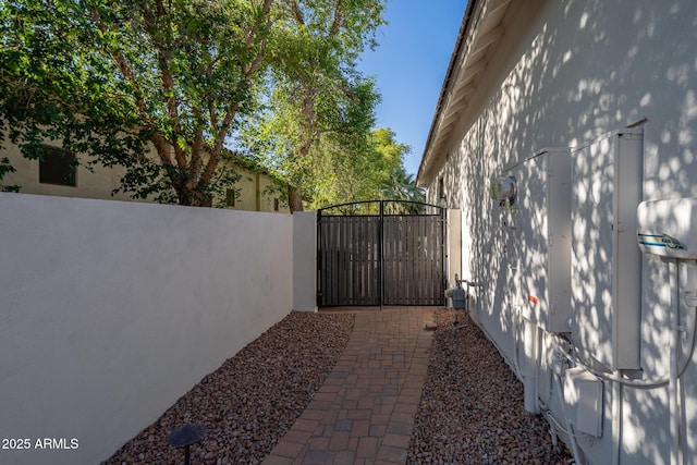 view of home's exterior featuring a gate and fence