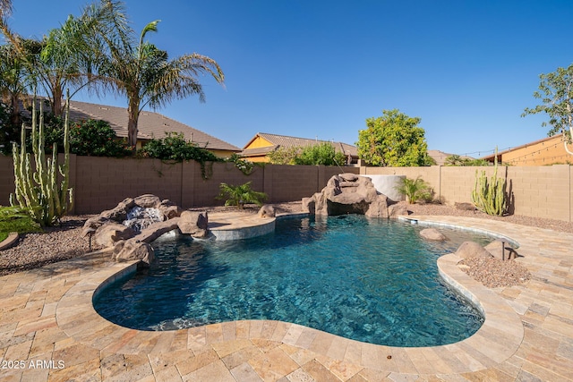 view of pool with a fenced backyard