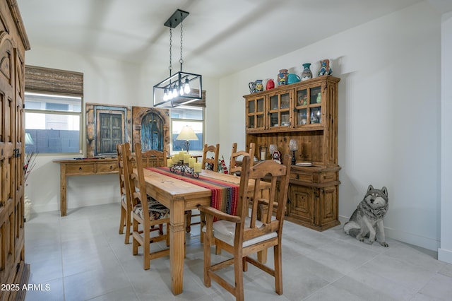 dining room with a healthy amount of sunlight and light tile patterned floors