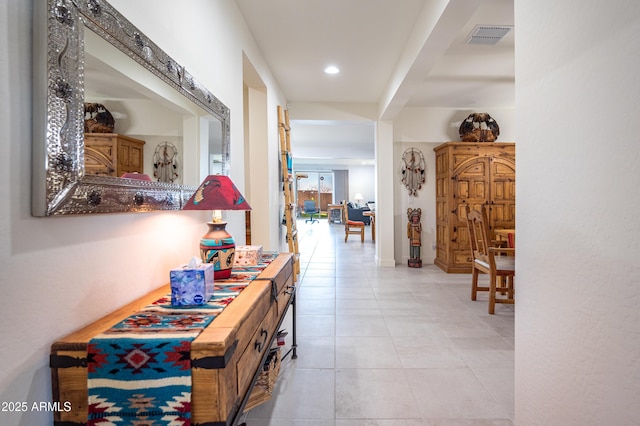 hallway with light tile patterned floors