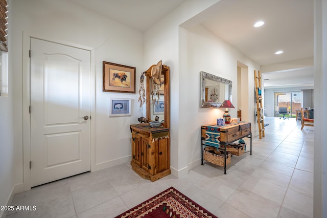 corridor featuring light tile patterned floors