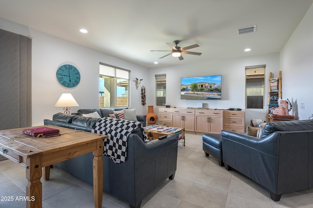 living room with light tile patterned floors and ceiling fan