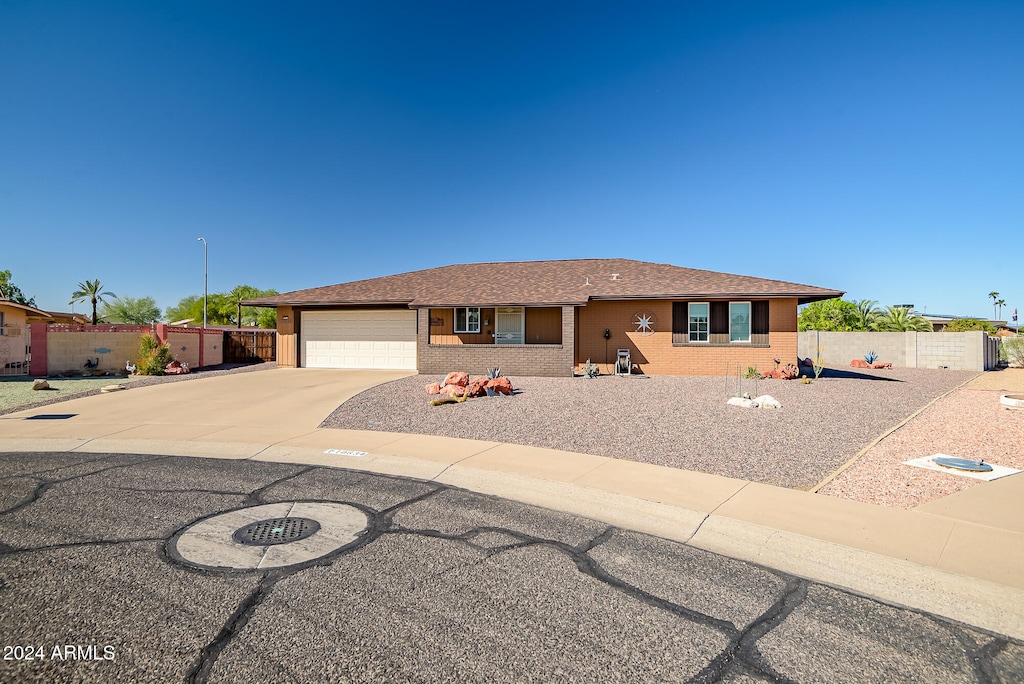 ranch-style house featuring a garage