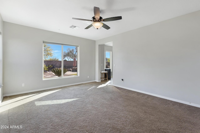 unfurnished room with carpet and ceiling fan