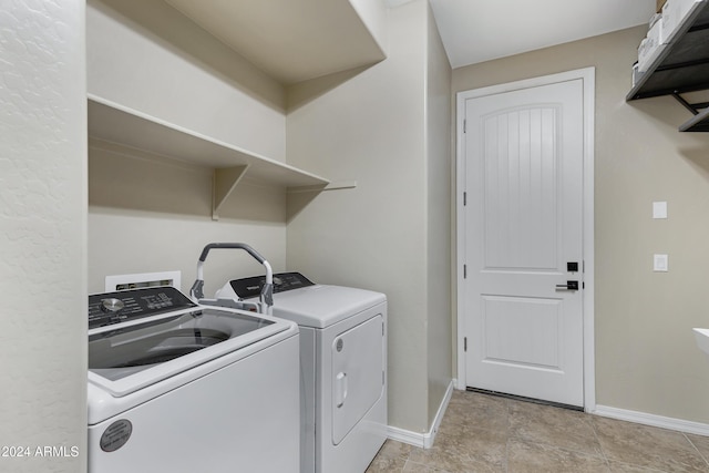 washroom featuring washer and clothes dryer