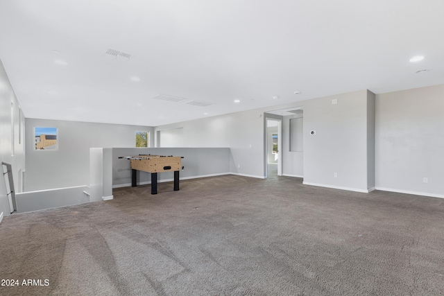 unfurnished living room featuring carpet