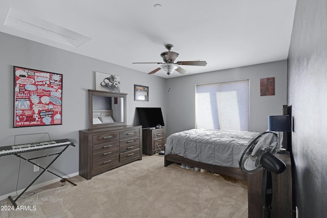 bedroom with ceiling fan and light colored carpet