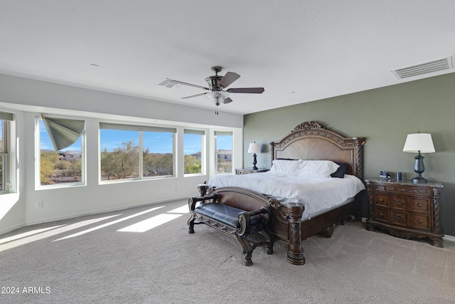 bedroom with light colored carpet and ceiling fan