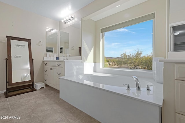 bathroom with a bath and vanity