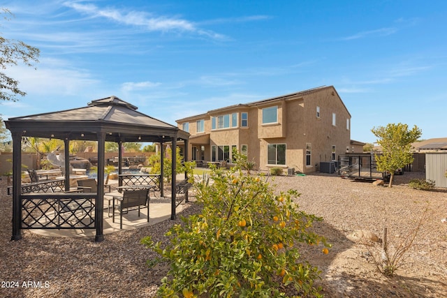 view of property's community with a gazebo and a patio area